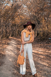 Portrait of smiling young woman in park