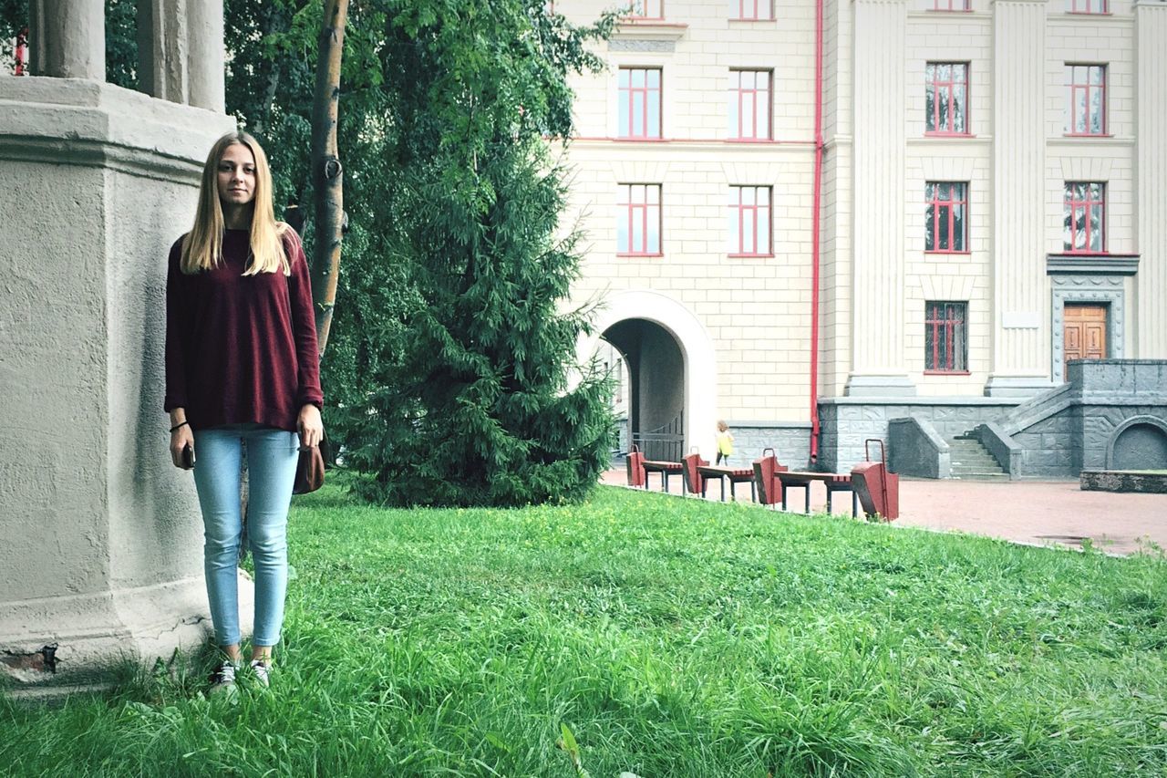 PEOPLE WALKING ON GRASSY FIELD