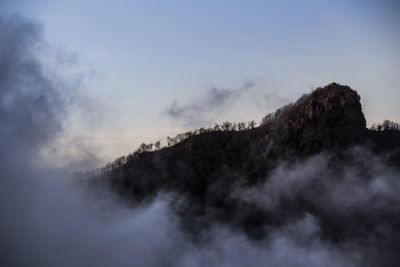 Scenic view of tree mountains against sky