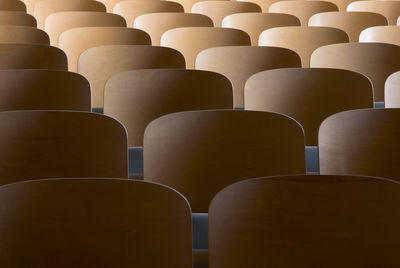 Low angle view of empty chairs in stadium