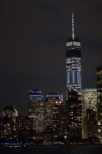 View of skyscrapers lit up at night