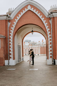 Rear view of woman walking in building