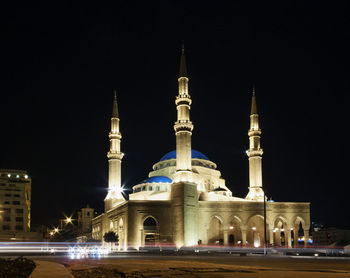 View of illuminated building against sky at night