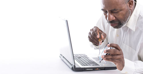 Man using laptop on table