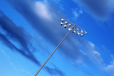 Low angle view of communications tower against sky