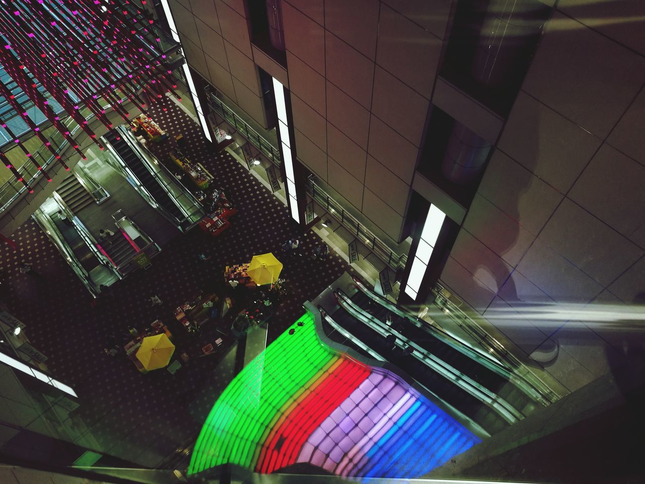 indoors, high angle view, architecture, illuminated, modern, decoration, multi colored, subway station, no people