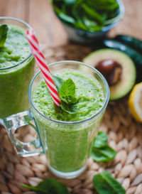 Close-up of green smoothie in a glass with fresh mint