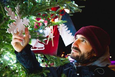 Portrait of man with christmas tree