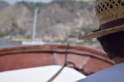 Close-up of man in boat sailing on sea