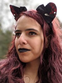 Close-up of hipster woman looking away outdoors