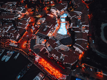 High angle view of illuminated buildings in city at night