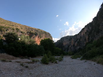 Scenic view of landscape and mountains against sky