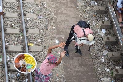 High angle view of girl standing in city