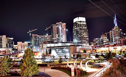 Illuminated cityscape against sky