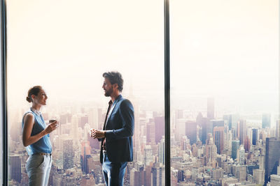 Panoramic view of man standing in city