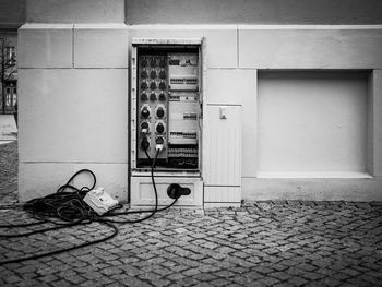 View of tiled floor with an electric cabinet 