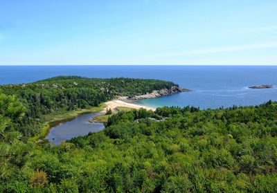 Scenic view of sea against clear blue sky