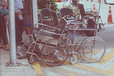 Bicycle parked on sidewalk by street