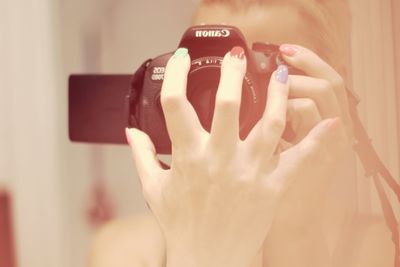 Close-up of woman holding smart phone