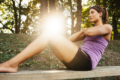 Young woman stretching, uppsala, sweden