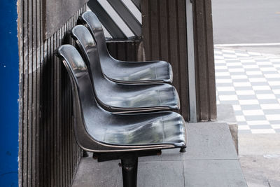 High angle view of empty chair on sunny day