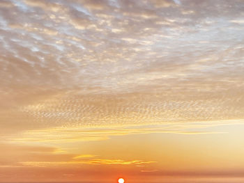 Low angle view of dramatic sky during sunset