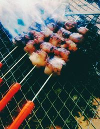 Close-up of meat on barbecue grill