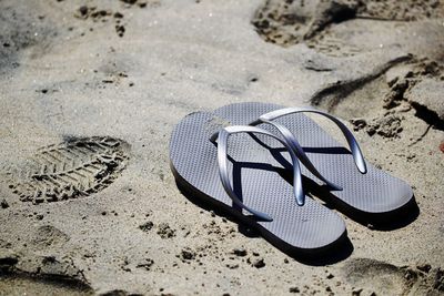 High angle view of shoes on sand