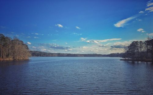 Scenic view of lake against blue sky