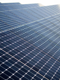 Low angle view of electricity pylon against sky