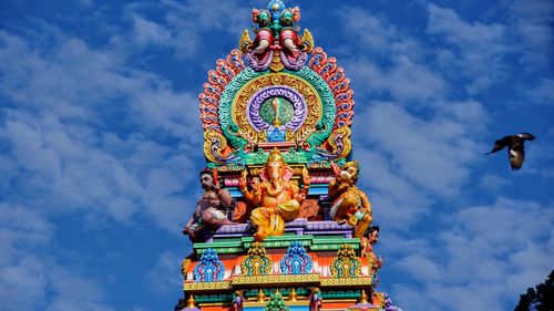 Low angle view of statue against sky