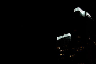 Low angle view of modern building at night