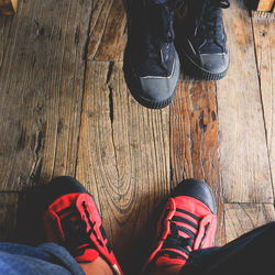 Low section of men on hardwood floor