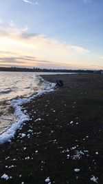 Scenic view of sea against sky at sunset