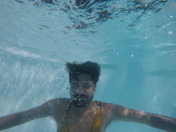 Portrait of man swimming in sea