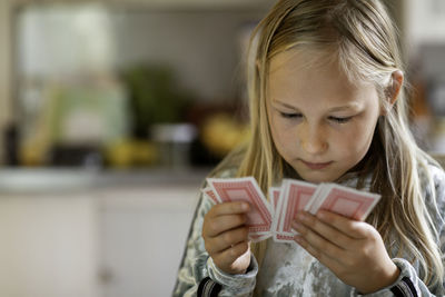 Girl playing cards