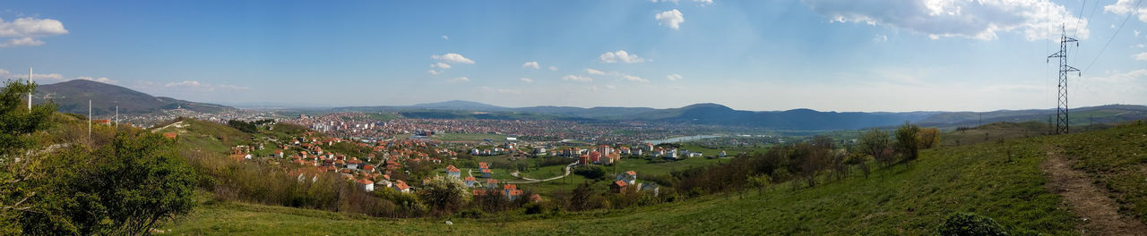 Panoramic view of field against sky