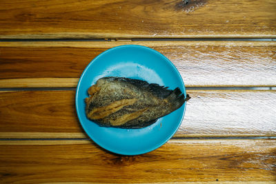 High angle view of blue bread in bowl on table