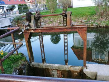 Metallic structure in swimming pool by lake