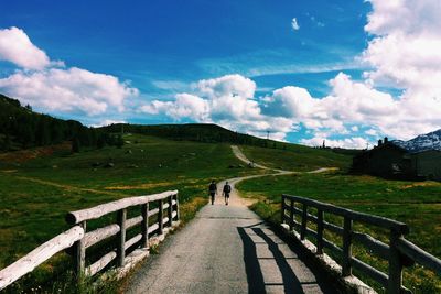 Scenic view of landscape against cloudy sky