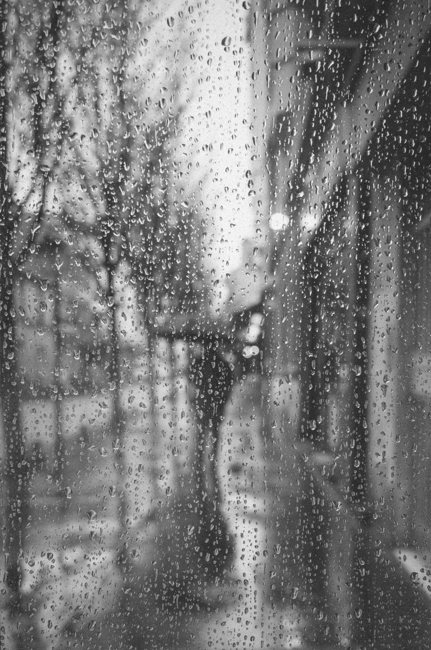 FULL FRAME SHOT OF RAINDROPS ON GLASS WINDOW