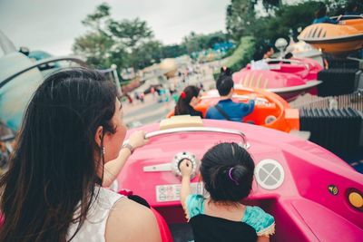 Rear view of women with umbrella