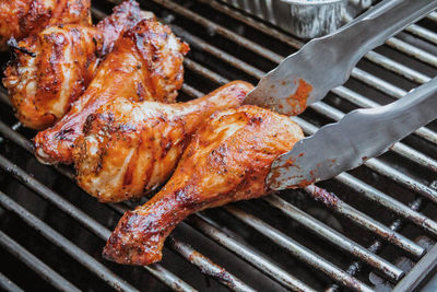 High angle view of meat on barbecue grill