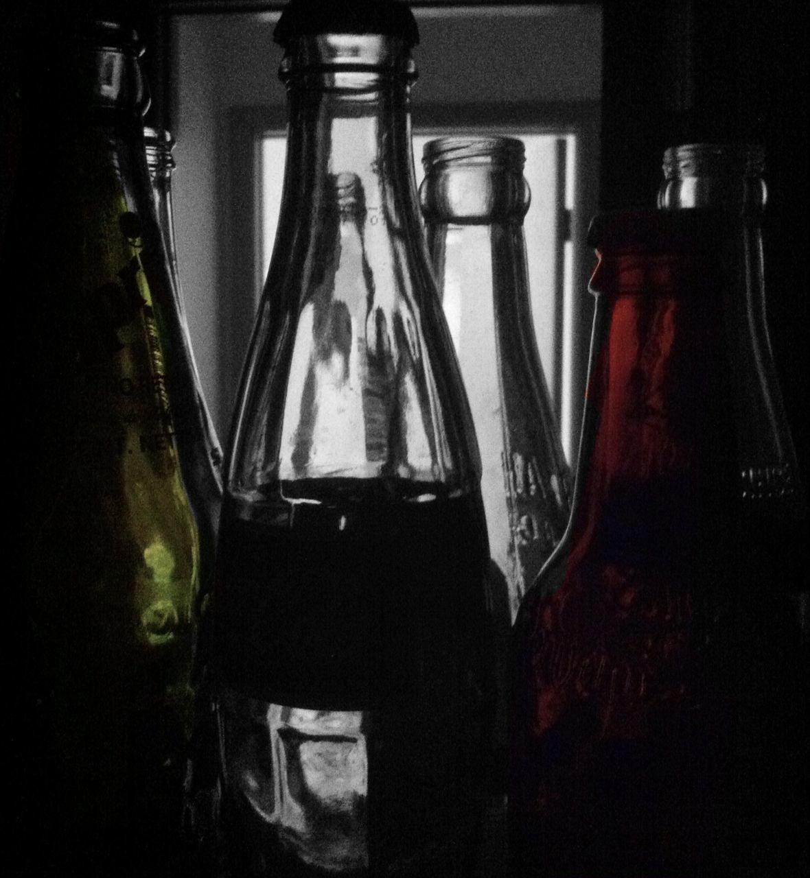 indoors, still life, home interior, close-up, table, glass - material, absence, no people, empty, domestic room, transparent, curtain, dark, in a row, chair, bottle, selective focus, technology, reflection, room
