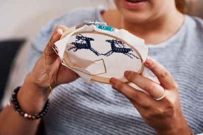 Midsection of woman holding gift