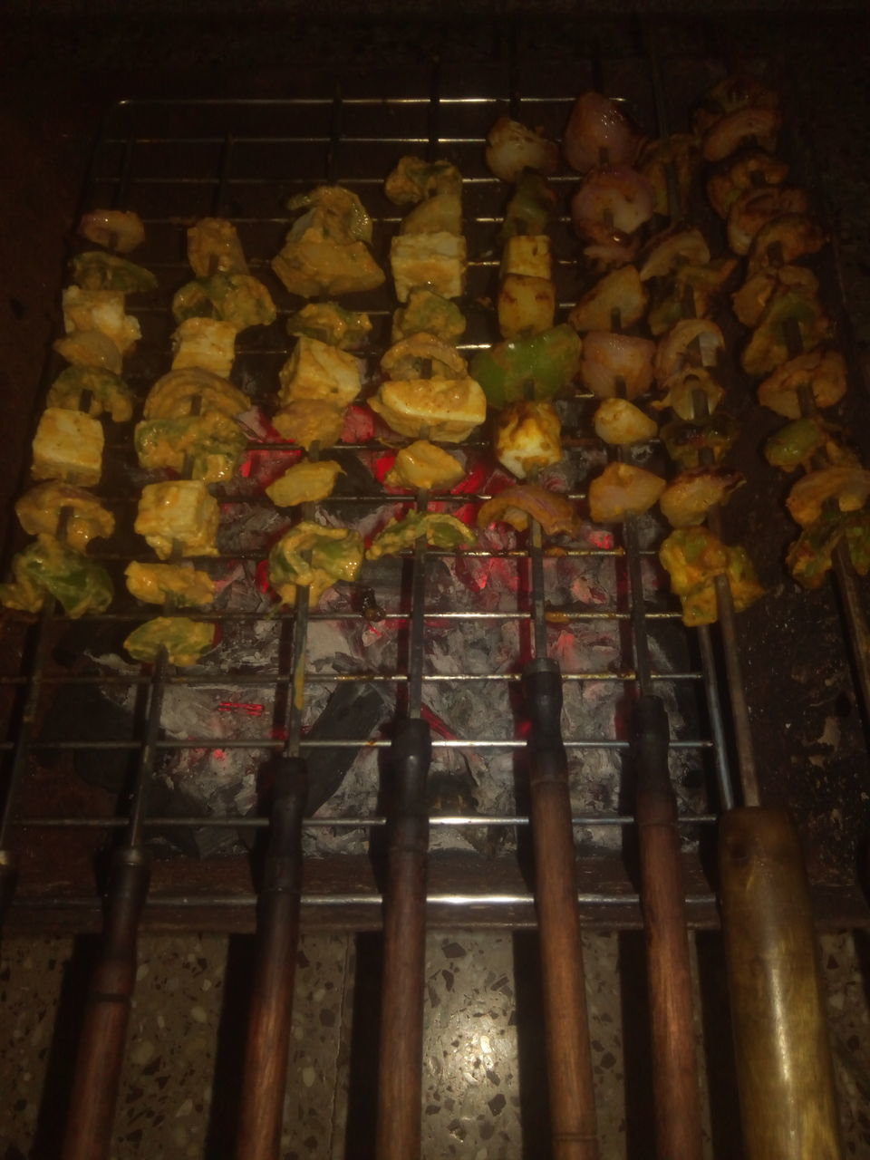 HIGH ANGLE VIEW OF VEGETABLES ON BARBECUE GRILL AT TEMPLE