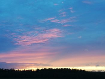 Scenic view of silhouette trees against sky during sunset