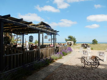 Restaurant at beach against sky