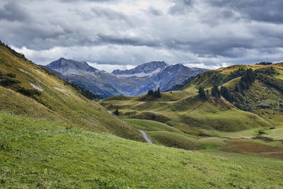 Scenic view of landscape and mountains against sky