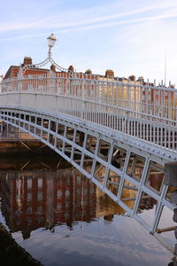 View of bridge over canal against buildings